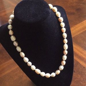 18” White and slightly cream colored Pearl Necklace.